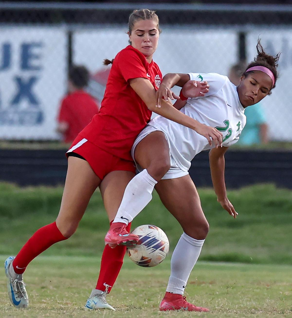 South Meck’s Caroline Wawak, left and Myers Park’s Amaya Falzarano, right, fight for control of the ball during action on Tuesday, May 6, 2025. Myers Park defeated South Meck 2-1.