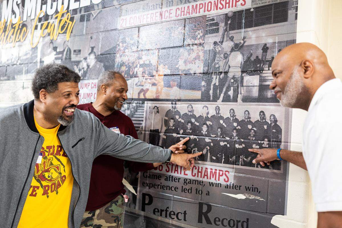 West Charlotte 1986 State Championship basketball players, Maurice Caldwell, from left, Duane Montgomery and Jules Springs pose for a portrait at West Charlotte High School in Charlotte, N.C., on Monday, March 9, 2026. 