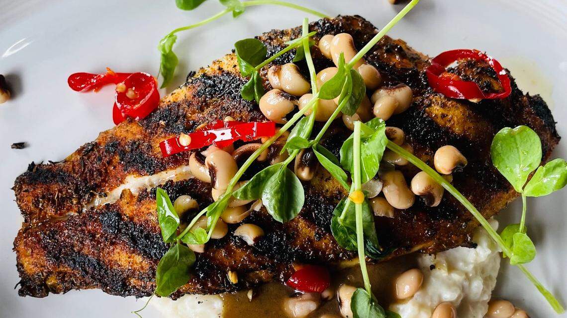 Leah & Louise’s Mud Island has blackened catfish, smoked catfish stew, rice grits, pickled field pea and candied pepper. 