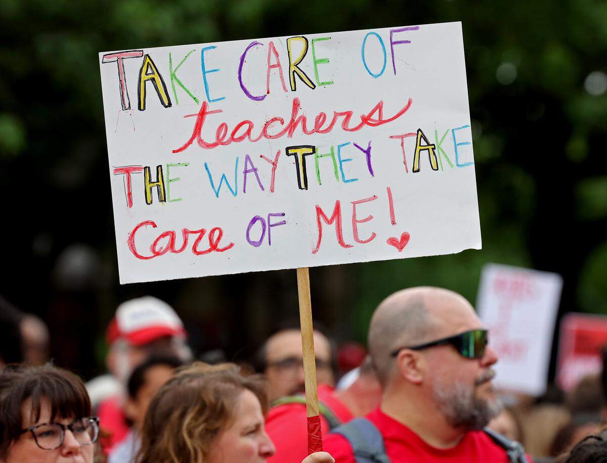 Signs, signs, signs were everywhere as teachers rallied at the Government Complex in Raleigh.