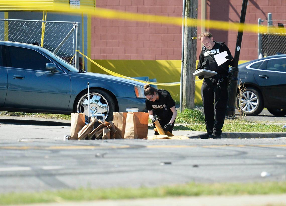 Charlotte-Mecklenburg Police CSIs investigate the aftermath of a shooting along Beatties Ford Road near Catherine Simmons Avenue on Monday, June 22, 2020. Two people were killed and at least a dozen were hurt late Sunday after a street party erupted in gunfire in the the 1800 block of Beatties Ford Road in Charlotte, Charlotte-Mecklenburg Police say. Multiple people were hit by vehicles.