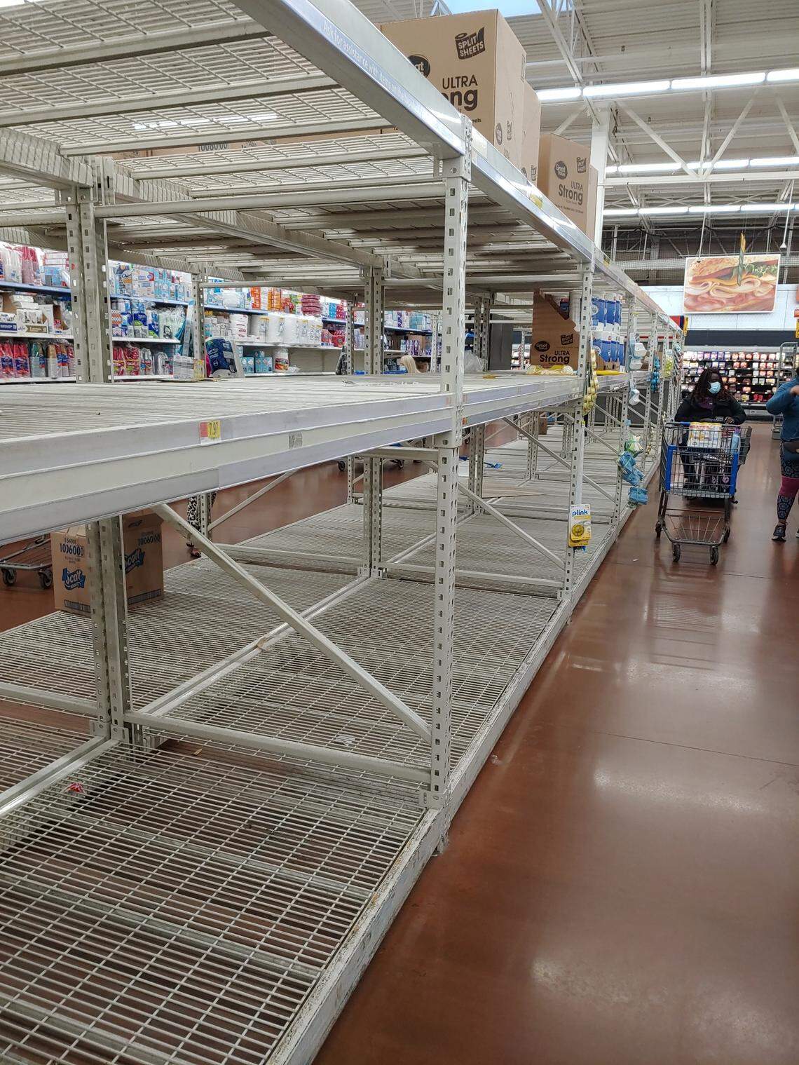 Terry McMillian shared a photo of empty shelves at a Walmart at about 7 a.m. Wednesday in Sanford saying “No paper Items this morning.”