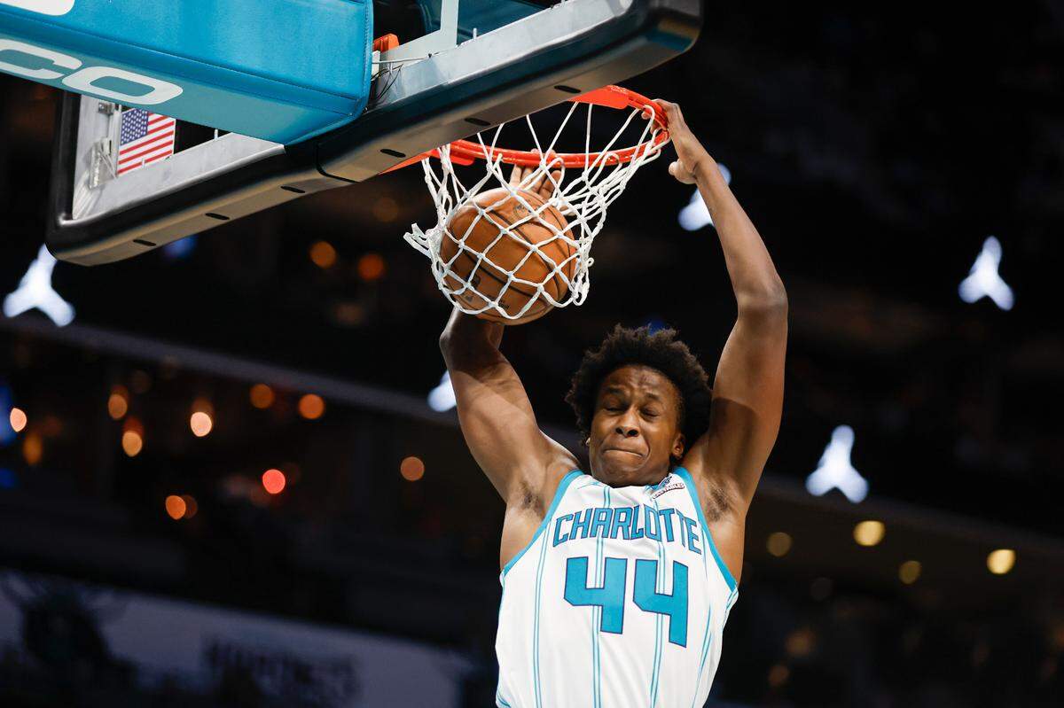 Oct 15, 2023; Charlotte, North Carolina, USA; Charlotte Hornets center Nick Richards Charlotte Hornets guard Frank Ntilikina (44) dunks against the Oklahoma City Thunder in the second half at Spectrum Center. Mandatory Credit: Nell Redmond-USA TODAY Sports