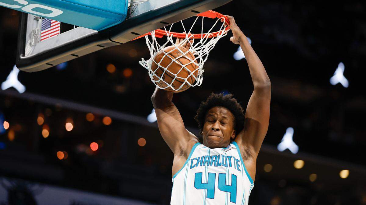 Oct 15, 2023; Charlotte, North Carolina, USA; Charlotte Hornets center Nick Richards Charlotte Hornets guard Frank Ntilikina (44) dunks against the Oklahoma City Thunder in the second half at Spectrum Center. Mandatory Credit: Nell Redmond-USA TODAY Sports