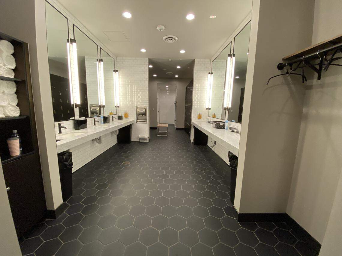 The women’s locker room at Barry’s includes Dyson hair dryers with several attachments, toiletries, lotion, bobby pins and q-tips.