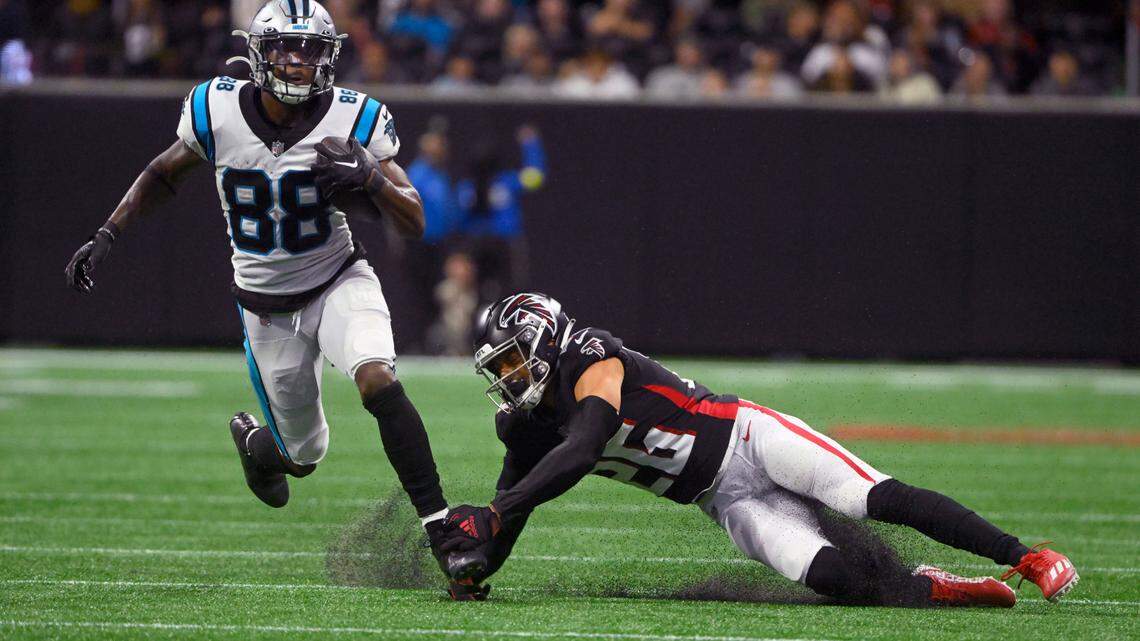Carolina Panthers wide receiver Terrace Marshall Jr. (88) runs with the ball as Atlanta Falcons cornerback Isaiah Oliver (26) defends during the second half of an NFL football game Sunday, Oct. 30, 2022, in Atlanta. (AP Photo/John Amis)