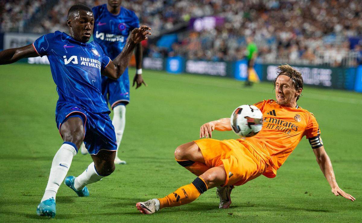 Luka Modric falls as he loses control of the ball during the Real Madrid v. Chelsea FC game at the Bank of America stadium on August 6, 2024. Real Madrid won the “friendly,” 2-1, before more than 62,000 fans. PRESTON JENKINS pjenkins@charlotteobserver.com