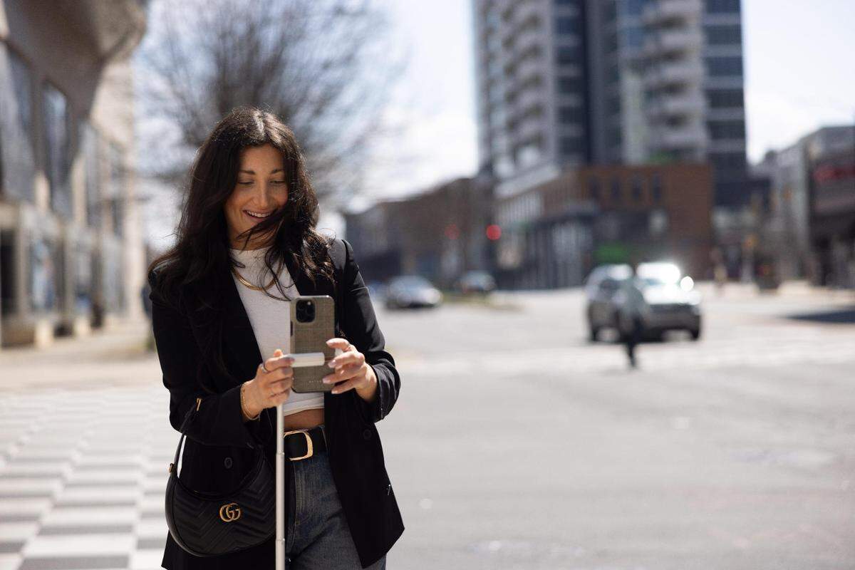 Charlotte influencer, Sydney Bernhardt, films content for social media in Uptown.