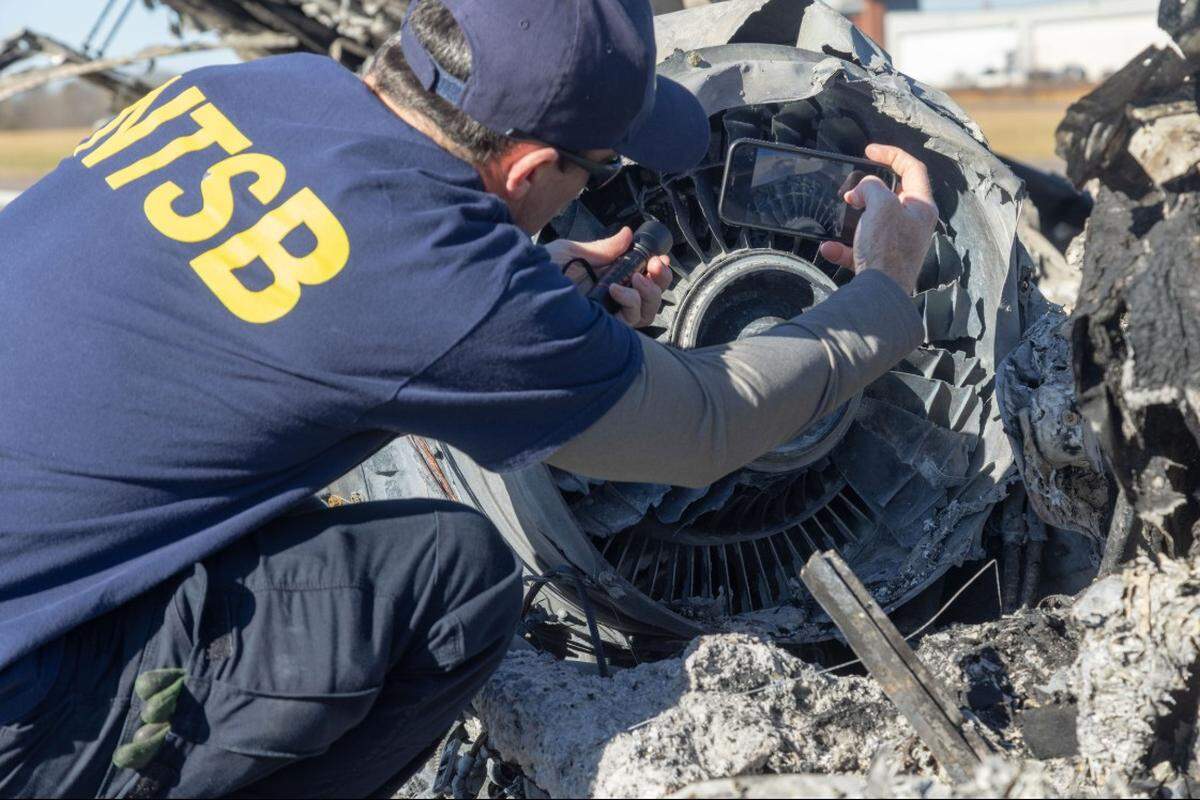 An NTSB investigator documents one of the engines from the Cessna Citation C550 that crashed in Statesville on Dec. 18, 2025.
