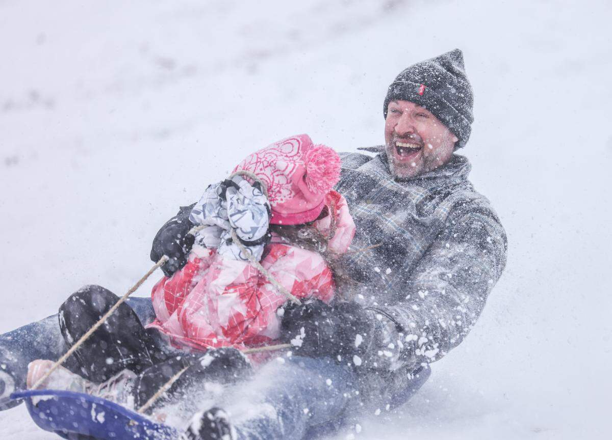 People sled in Cordelia Park in Charlotte, N.C., on Saturday, January 31, 2026.