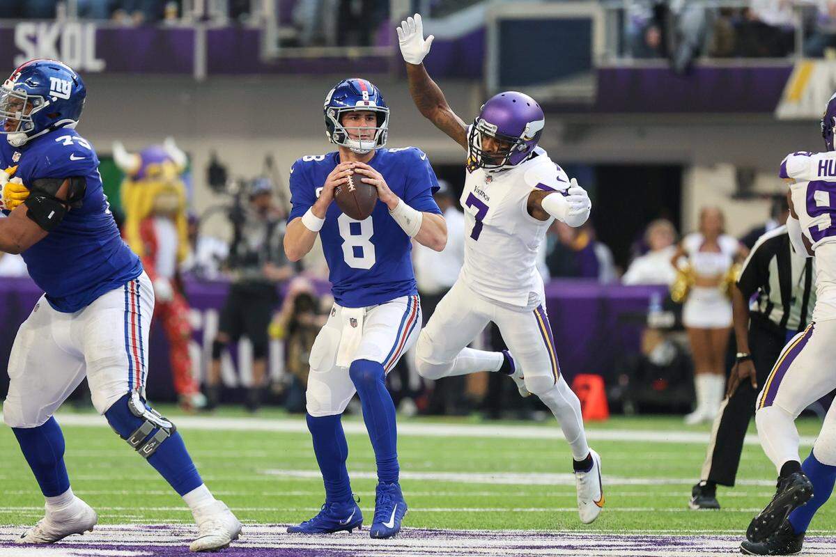 Dec 24, 2022; Minneapolis, Minnesota, USA; New York Giants quarterback Daniel Jones (8) is sacked by Minnesota Vikings cornerback Patrick Peterson (7) during the second quarter at U.S. Bank Stadium. Mandatory Credit: Matt Krohn-USA TODAY Sports
