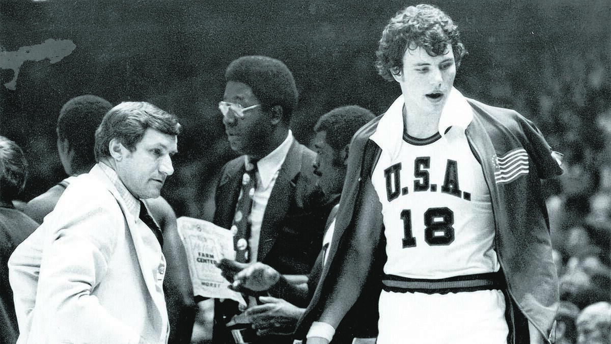Now-Charlotte Hornets general manager Mitch Kupchak (right), playing for the U.S. Olympic team after his senior season at North Carolina in 1976, got a telegram via coach Dean Smith (left), informing him he'd been drafted by the then-Washington Bullets.