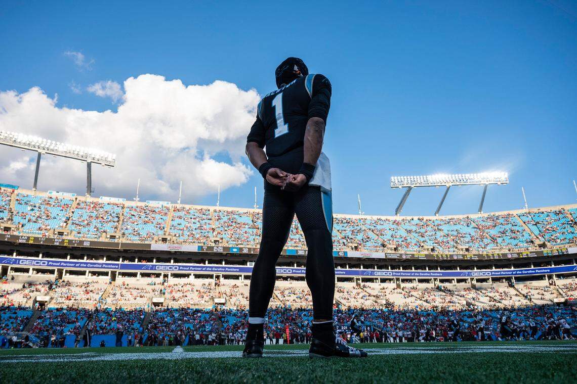Panthers quarterback Cam Newton stands on the sidelines and watches the game against the Buccaneers at Bank of America Stadium on Sunday, December 26, 2021 in Charlotte, NC. Newton’s contract end after this season and his future with the Panthers is uncertain.