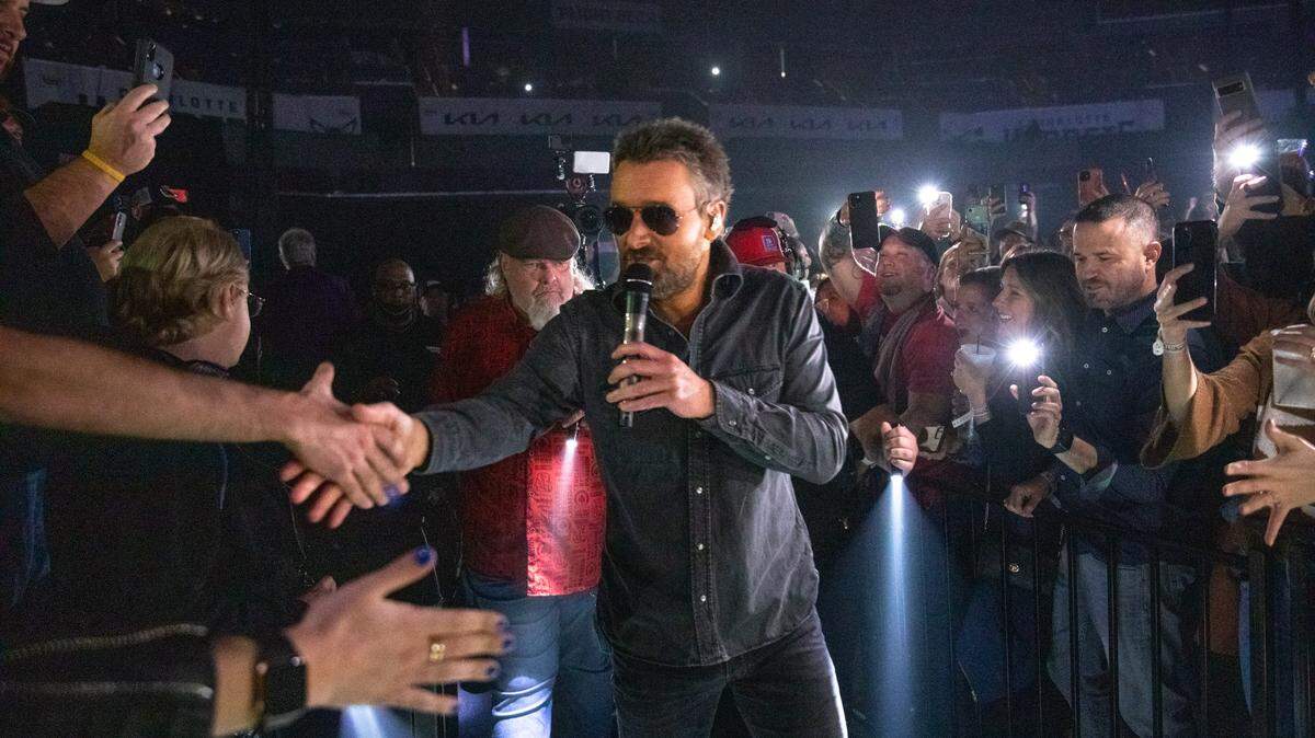 Eric Church wades into the crowd at Spectrum Center in Charlotte on Saturday night.