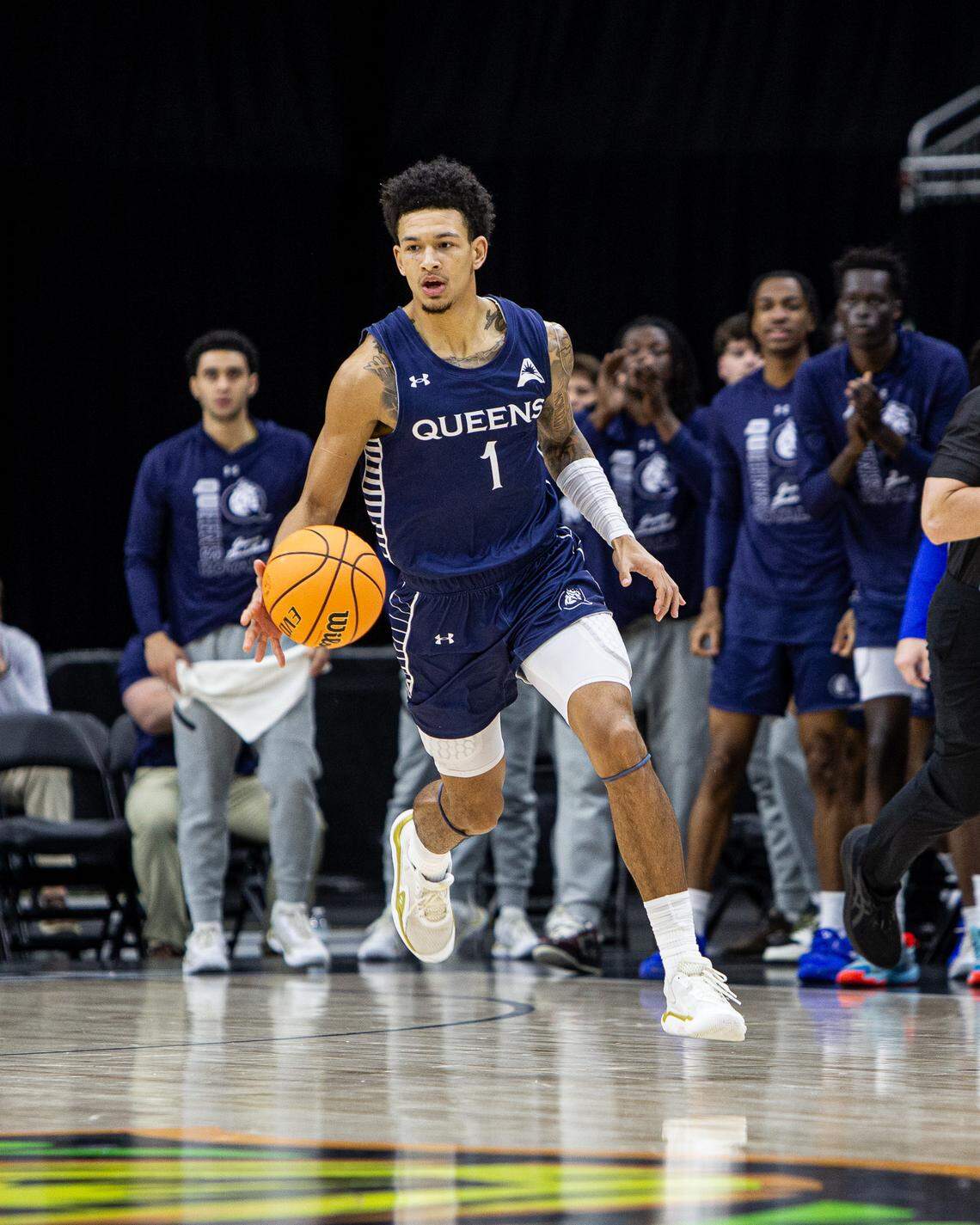Queens senior guard Nasir Mann dribbles downcourt in the ASUN championship game on Sunday, March 8, 2026. Queens beat Central Arkansas in overtime, 98-93, and Mann was named the tournament’s Most Valuable Player.