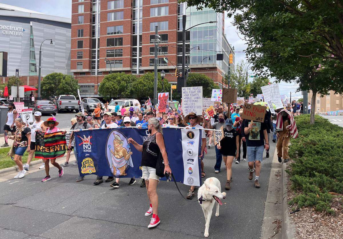 Protesters march in uptown Charlotte during the ‘No Kings, anti-Trump’ rally Saturday, June 14, 2025.