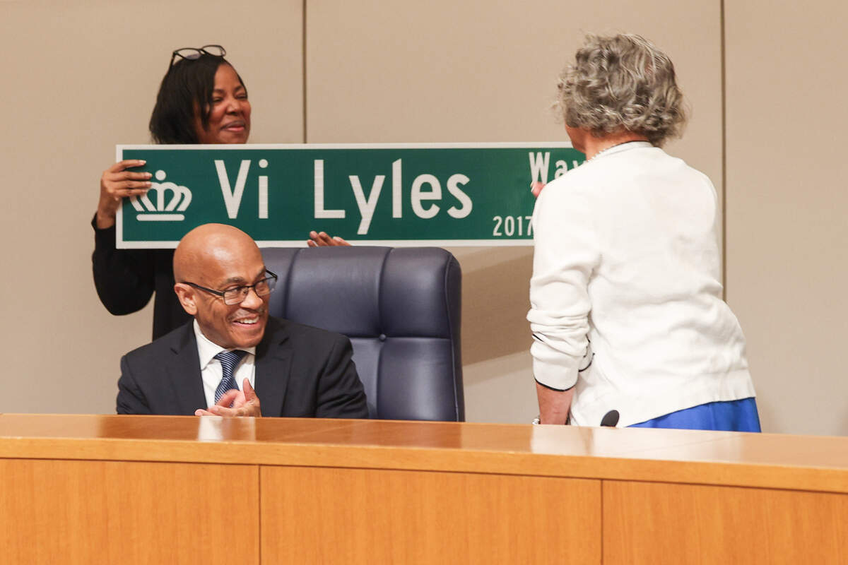Mayor Vi Lyles is presented with a street sign bearing her name “Vi Lyles Way” during her final city council meeting at the Charlotte-Mecklenburg Government Center in Charlotte on Monday, June 22, 2026