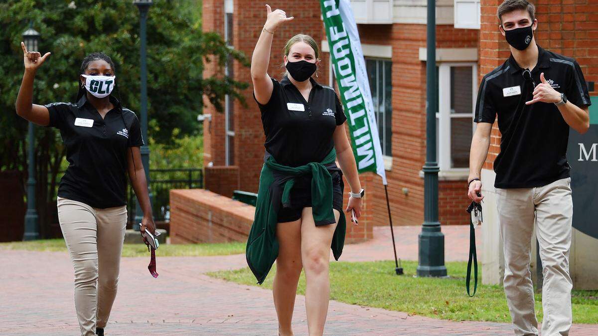 UNC Charlotte students arrive on campus before the start of fall classes. The university is testing all students in three dorms for COVID-19.