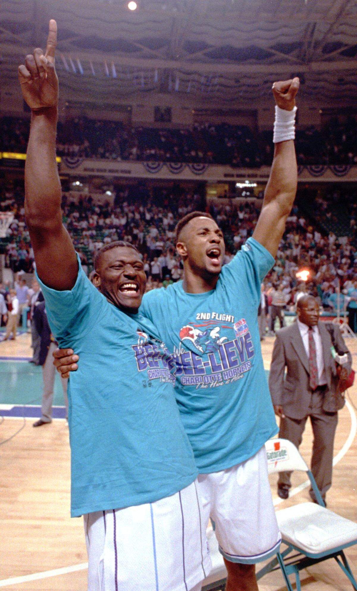  Larry Johnson and Alonzo Mourning celebrate after the Hornets’ 1993 NBA playoff win over the Boston Celtics.