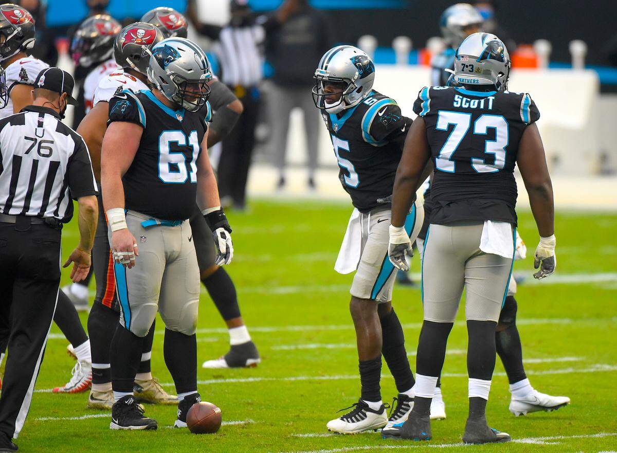 Carolina Panthers quarterback Teddy Bridgewater, center, is slow to get up from the turf after being sacked by Tampa Bay Buccaneers outside linebacker Jason Pierre-Paul Sunday. Bridgewater left the field under his own power but didn’t return to the game.