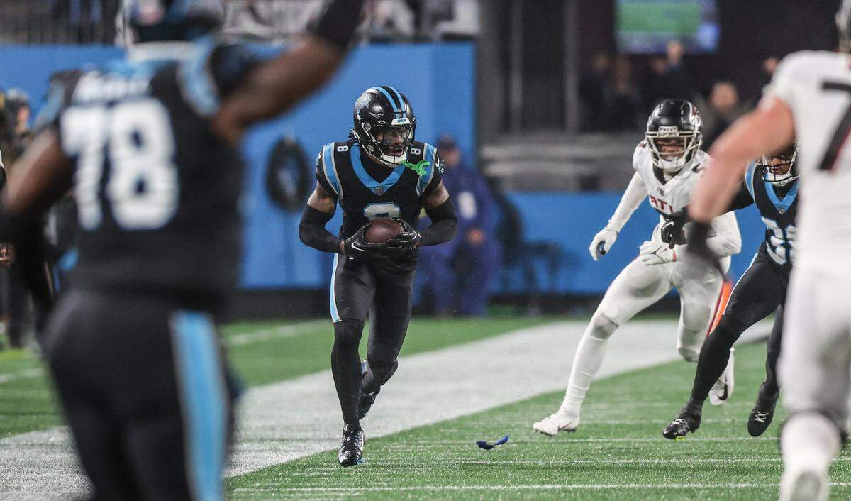 Carolina Panthers cornerback Jaycee Horn runs the ball to the end zone after interception a pass by Atlanta Falcons quarterback Marcus Mariota on Thursday, November 10, 2022.