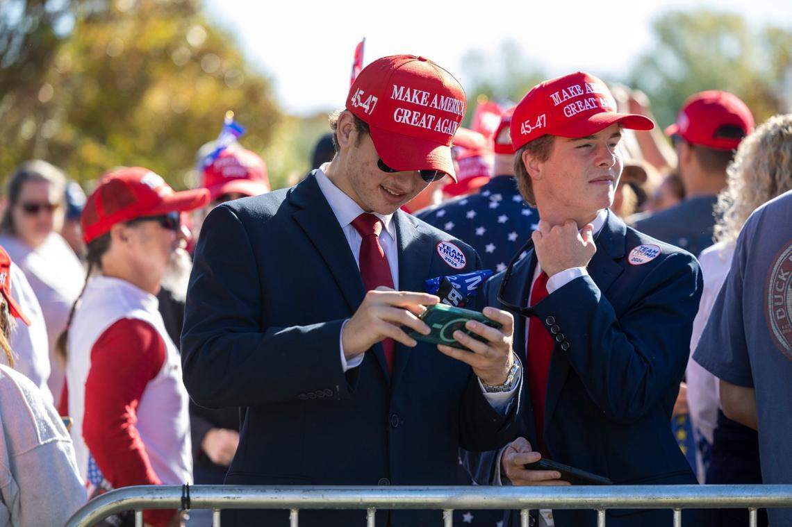 Supporters of former President Donald Trump gather outside Minges Coliseum in Greenville prior to a rally on Monday, Oct. 21, 2024.
