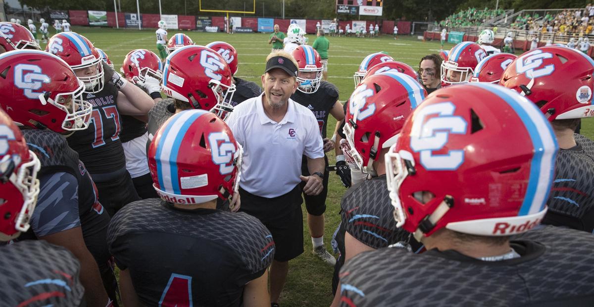 Charlotte Catholic Cougar head coach Mike Brodowicz huddles his team before facing Weddington before a prep football game at Charlotte Catholic High School Friday, September 28, 2018 in Charlotte, NC. Photo by JASON E. MICZEK - Special to the Observer