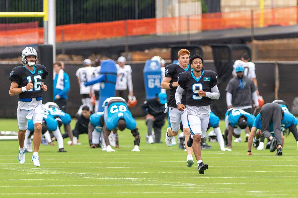 The Carolina Panthers quarterbacks run down the field during a joint practice session between the Browns and Panthers at the Bank of America Stadium practice fields in Charlotte, NC, Wednesday August 6, 2025.