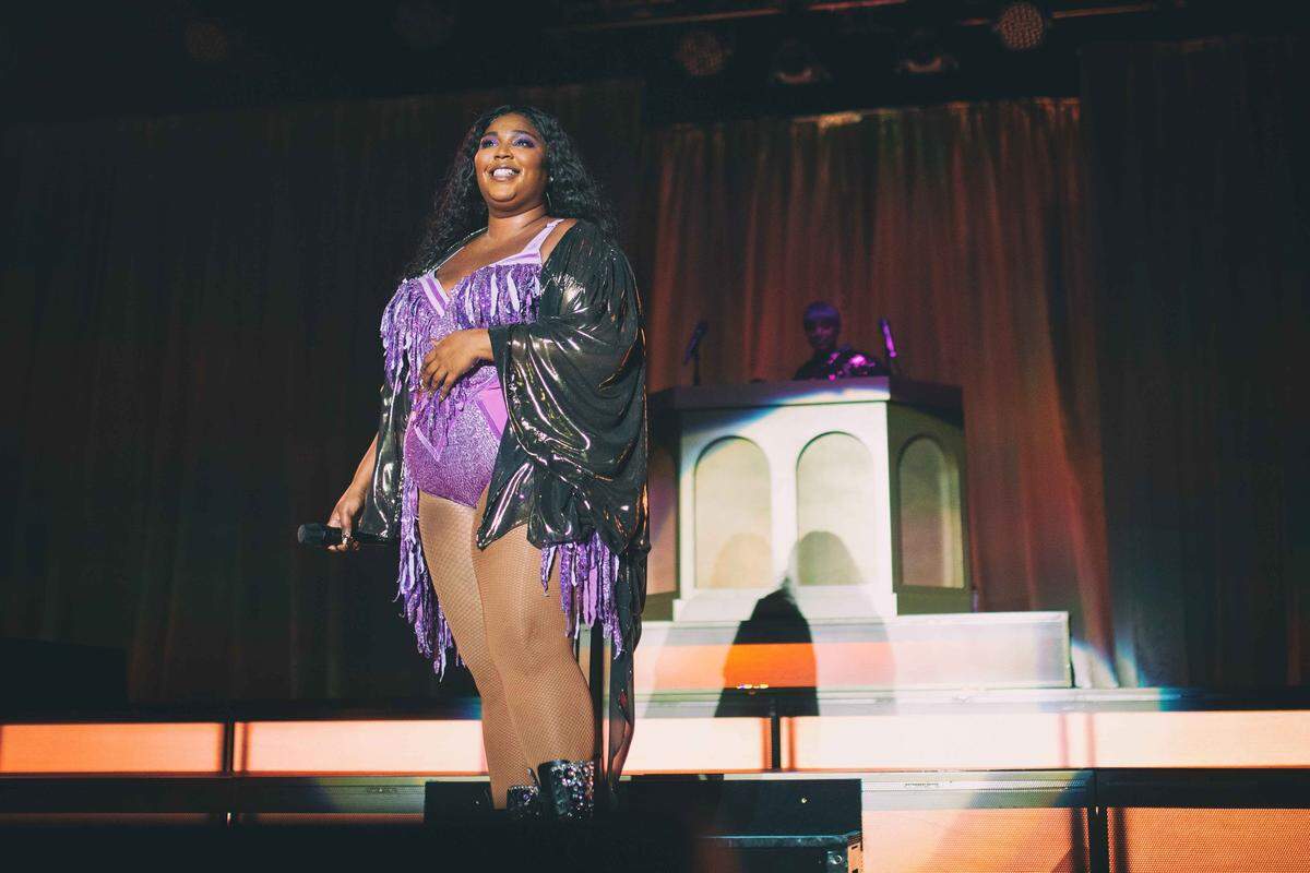 Lizzo donned a sparkly purple bodysuit on Sunday, September 16, 2019, at Charlotte Metro Credit Union Amphitheatre.