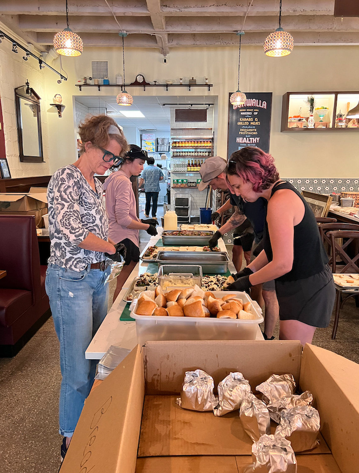 Chai Pani Restaurant Group team members in Asheville prep over 1,000 meals per day with the support of World Central Kitchen. The meals are delivered via helicopter to isolated areas across Western North Carolina.