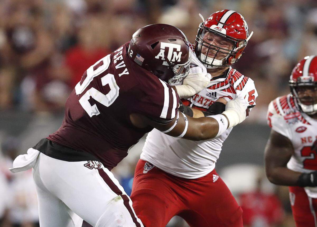 N.C. State center Garrett Bradbury, right, could be an option in the first round for his hometown Carolina Panthers.