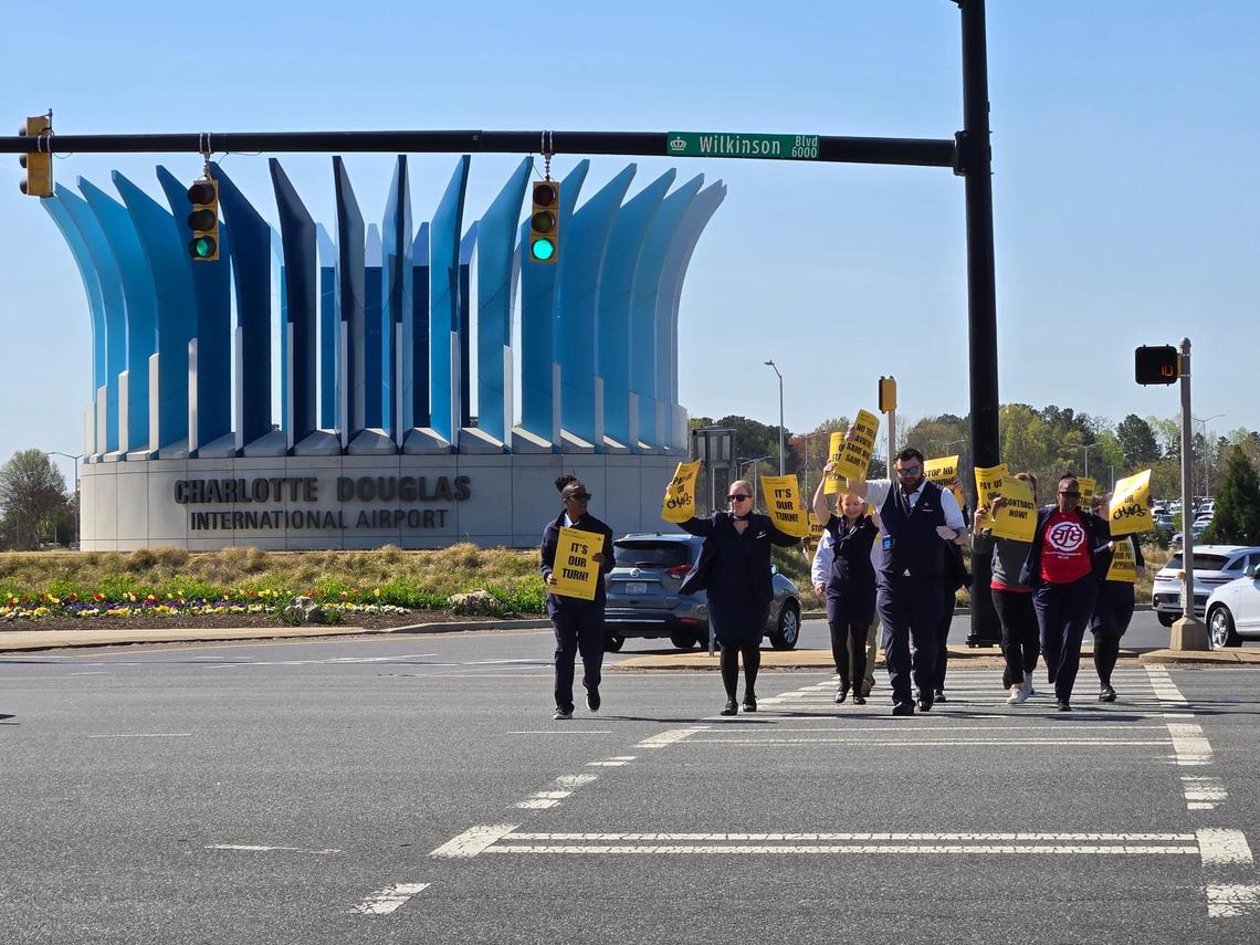 PSA flight attendants from Charlotte protest for more pay during a Wednesday demonstration.