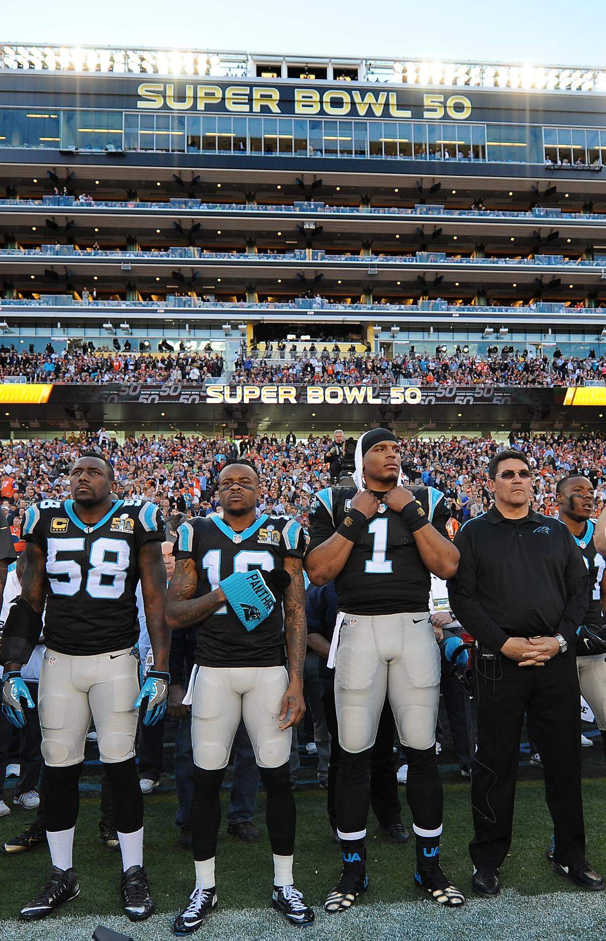 From left, Carolina Panthers linebacker Thomas Davis, wide receiver Ted Ginn Jr., quarterback Cam Newton and head coach Ron Rivera stand along the team's sideline in 2016 before the 50th Super Bowl. While the Panthers have played in the Super Bowl twice, Charlotte has never hosted it.
