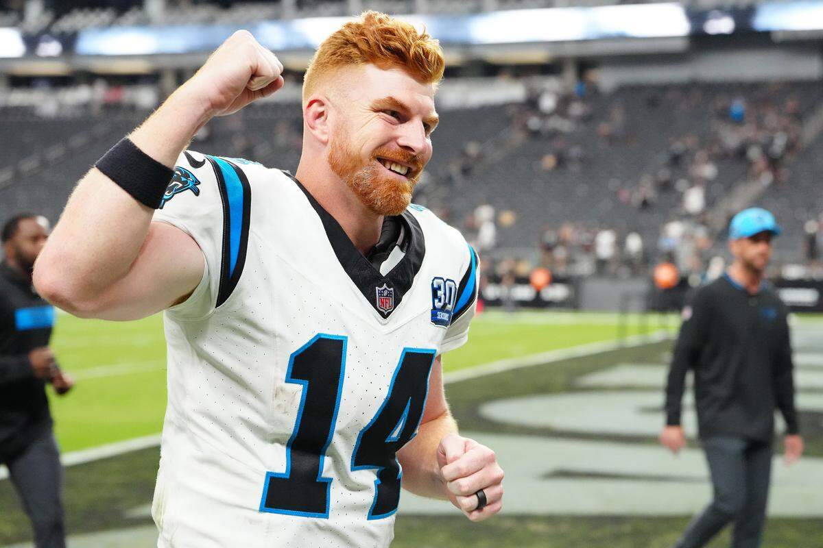 Carolina Panthers quarterback Andy Dalton (14) celebrates after the Panthers defeated the Las Vegas Raiders at Allegiant Stadium. Dalton threw for 319 yards and three touchdowns in the Panthers’ 36-22 win.
