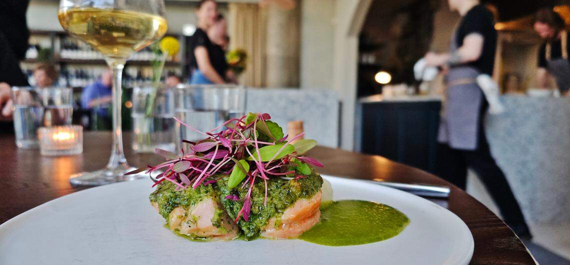 Salmon roulade, stuffed with spinach with a sunchoke puree and a fresh green garlic sauce at L’Ostrica.