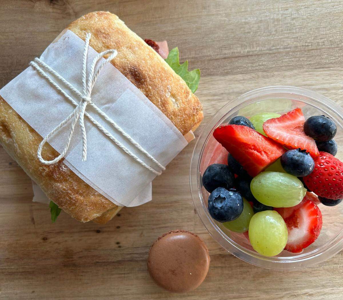 Table & Board offers a Ciabatta Lunch Box ($16) that comes with your choice of Prosciutto di Parma, caprese or grilled chicken with roasted red pepper, pesto and baby greens. It’s served with a French macaron and your choice of side.
