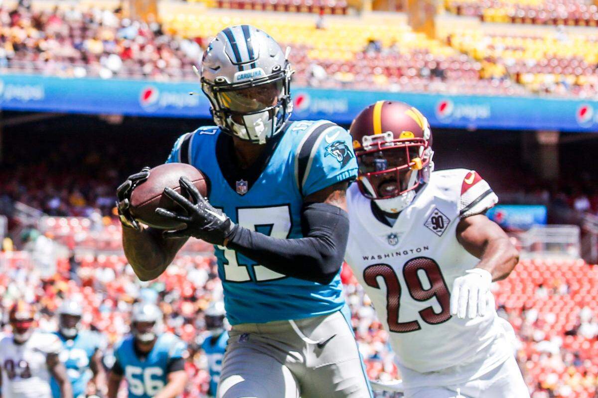 Carolina Panthers wide receiver Rashard Higgins (17) makes a touchdown catch over Washington Commanders cornerback Kendall Fuller (29) during the first half of a preseason NFL football game Saturday, Aug. 13, 2022, in Landover, Md. (Shaban Athuman/Richmond Times-Dispatch via AP)