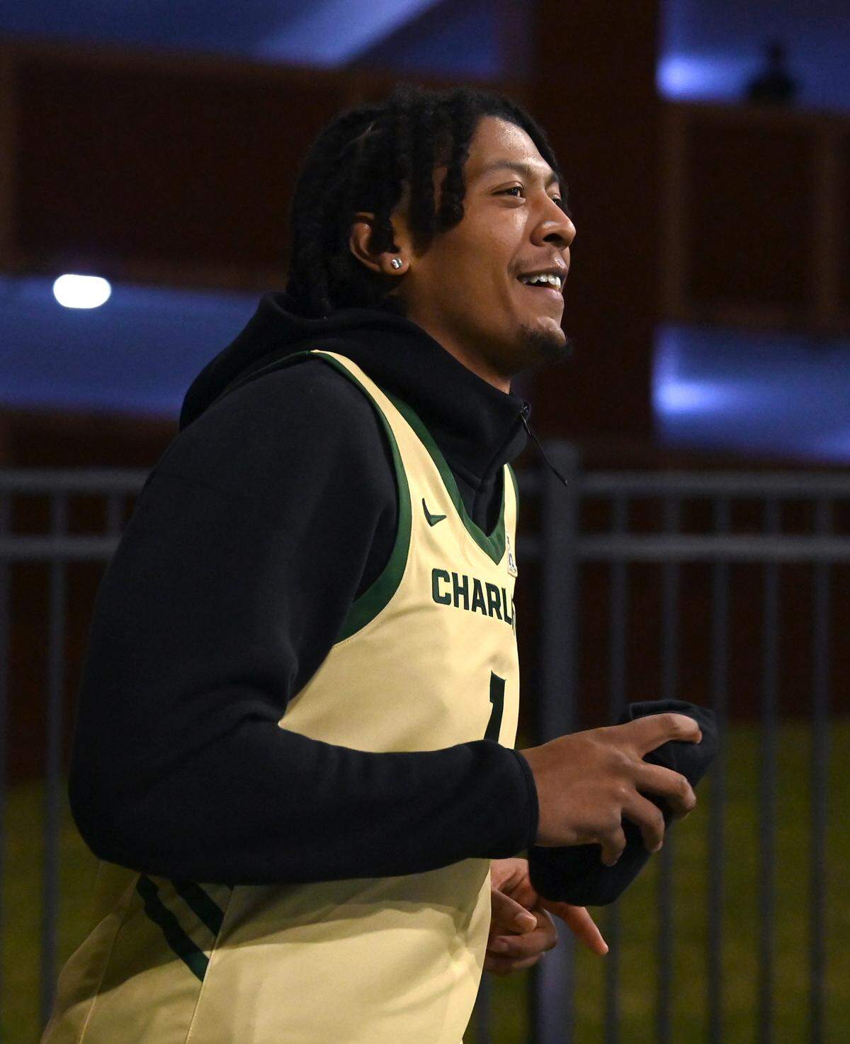 Charlotte 49ers men’s basketball player Giancarlo Rosado smiles as he looks toward the fans during his introduction at the University Recreation Center on the campus of UNC Charlotte on Thursday, October 17, 2024.