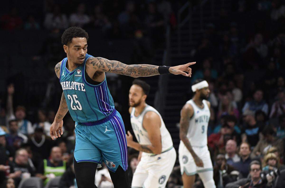Dec 2, 2023; Charlotte, North Carolina, USA;  Charlotte Hornets forward P.J. Washington Jr. (25) reacts after scoring during the first half against the Minnesota Timberwolves at the Spectrum Center. Mandatory Credit: Sam Sharpe-USA TODAY Sports