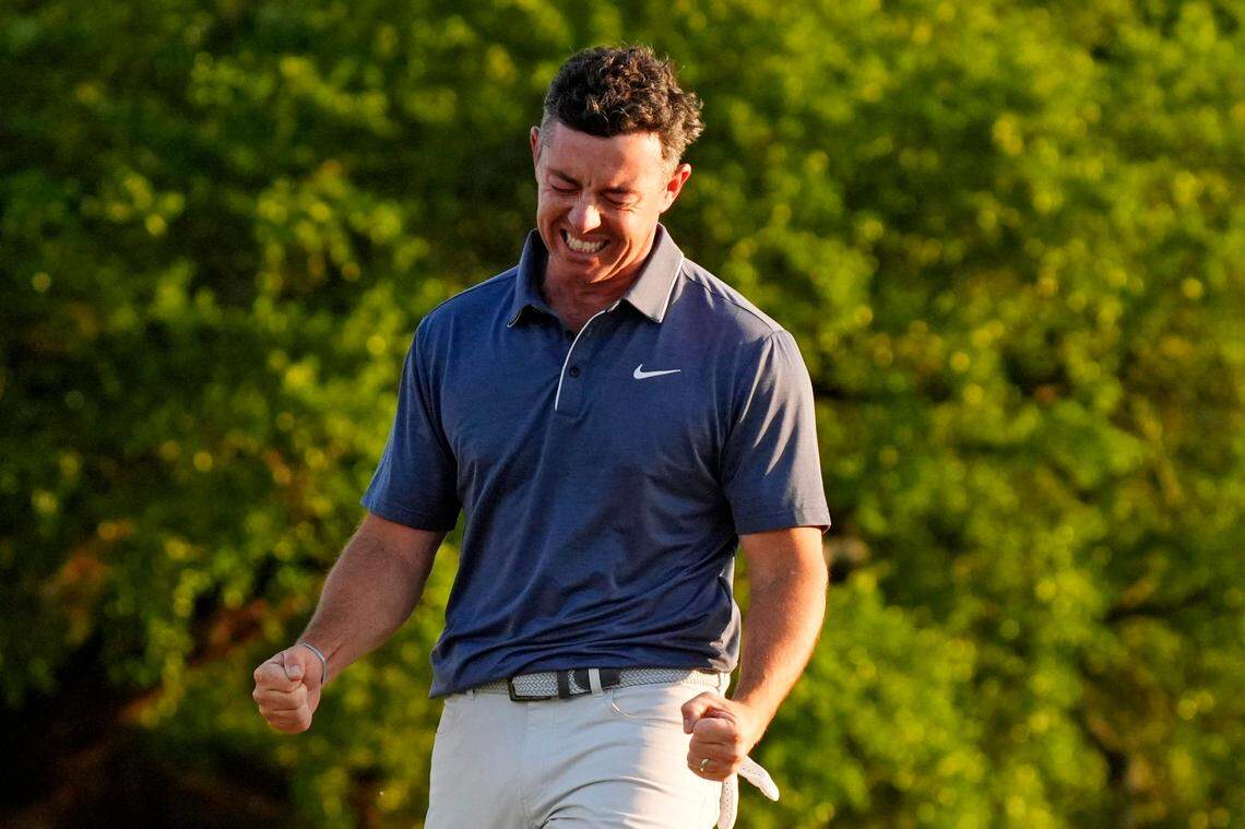 Rory McIlroy celebrates after winning a playoff on the 18th green during the final round of the Masters Tournament at Augusta National Golf Club.