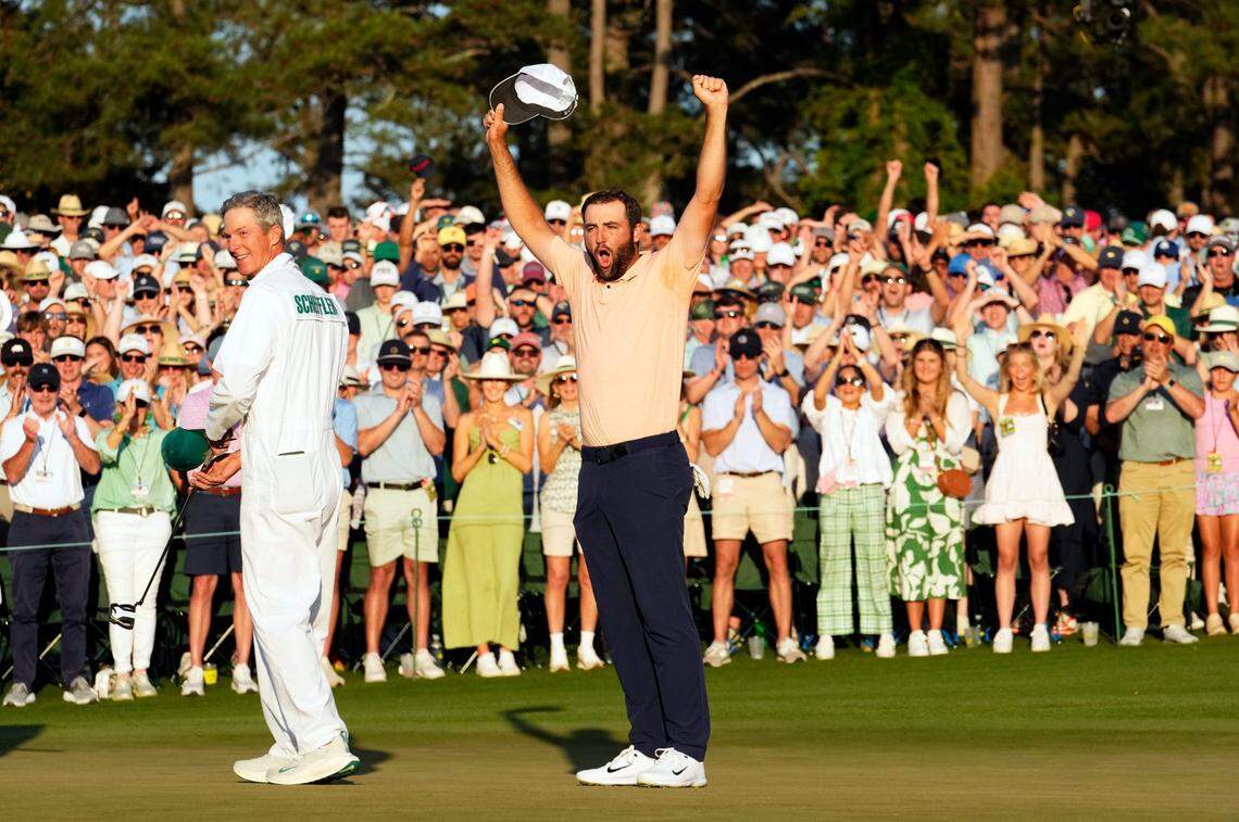 Scottie Scheffler celebrates on the 18th green after winning the 2024 Masters.