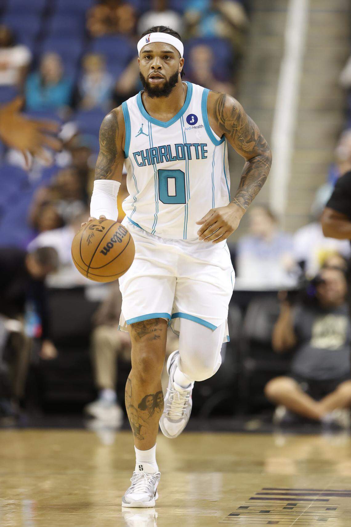 Charlotte Hornets forward Miles Bridges dribbles the ball up the court during first-quarter action against the Memphis Grizzlies at First Horizon Coliseum.