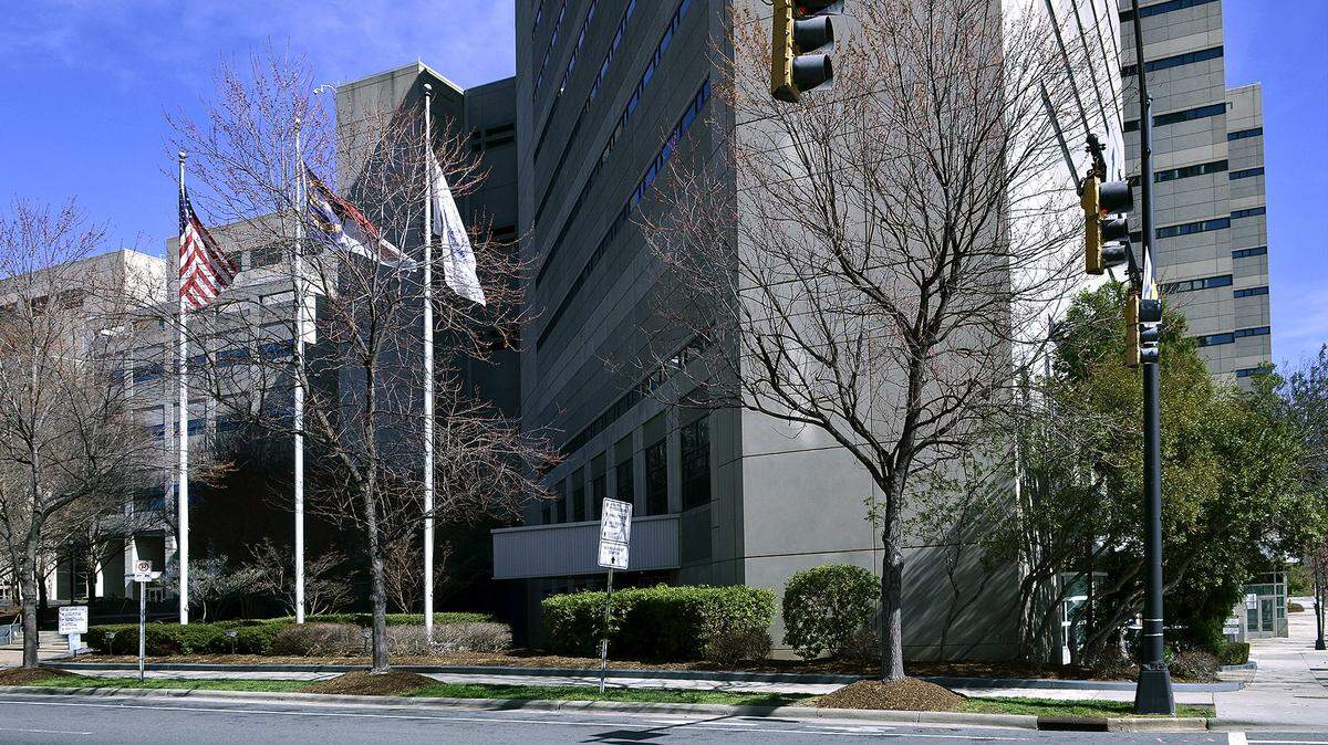 Flags sly out side of Mecklenburg County Jail Central. The Sheriff’s Office plans on transferring inmates to different NC county jails to help remedy issues found during a state inspection.