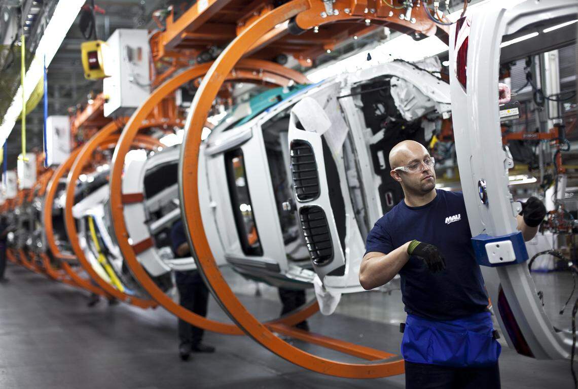 Jeff Lewis Neal works at BMW's plant in Greer, S.C., Oct. 29, 2013. The company offers a program called BMW Scholars that allows young workers to study at technical colleges and work, which experts say is a model for the nation as apprenticeships are a desperately needed option for younger workers who want decent-paying jobs, or increasingly, any job at all. (John W. Adkisson/The New York Times)