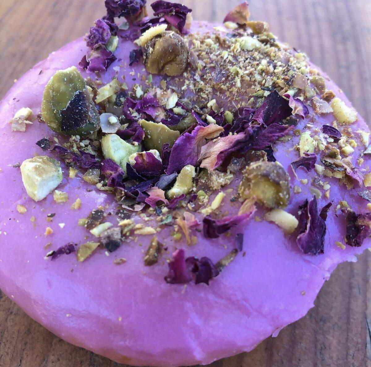 Share half a dozen Pistachio Rose doughnuts from Reigning Donuts on Valentine’s Day.