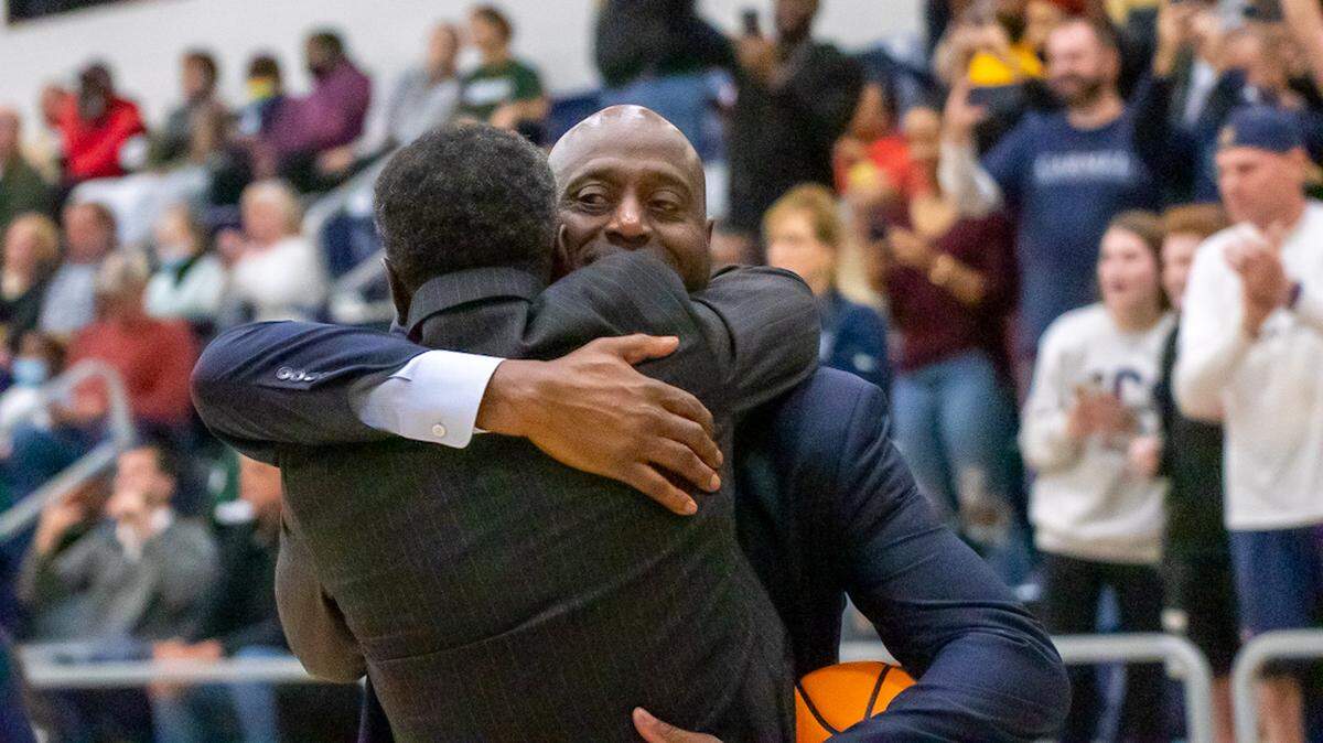 Carmel Christian coaches embrace after winning the championship