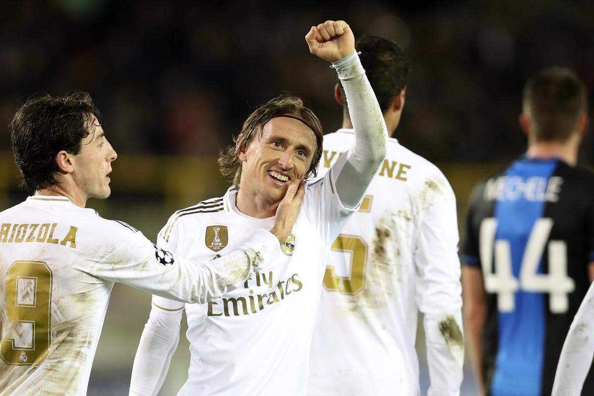 Real Madrid’s Luka Modric, center, jubilates after scoring his sides third goal during the Champions League group A soccer match between Brugge and Real Madrid at the Jan Breydel stadium in Bruges, Belgium, Wednesday, Dec. 11, 2019. (AP Photo/Francisco Seco)