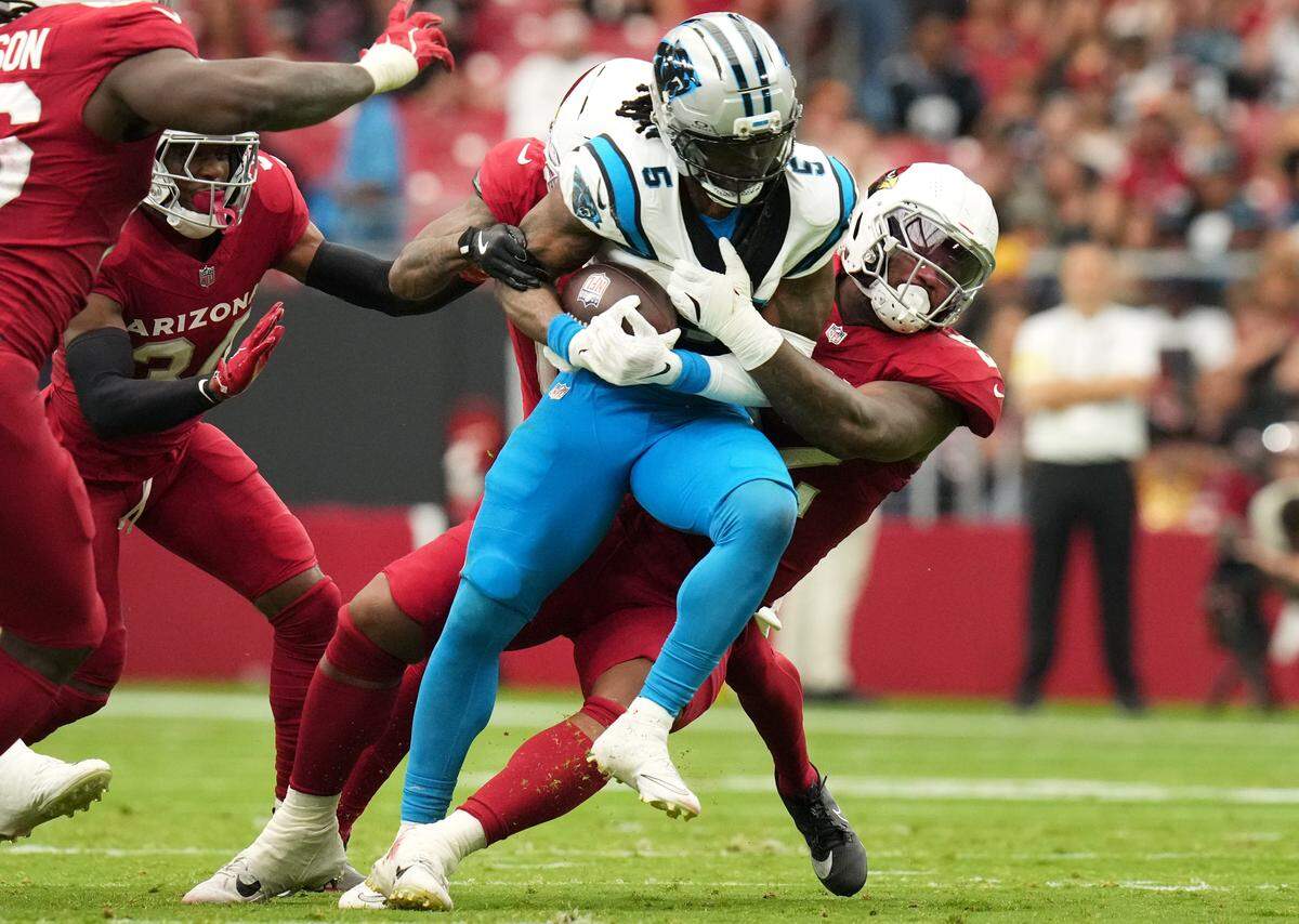 Arizona Cardinals linebacker Jordan Burch (52) tackles Carolina Panthers running back Rico Dowdle (5) at State Farm Stadium in Glendale, AZ on Sunday, Sept. 14, 2025.