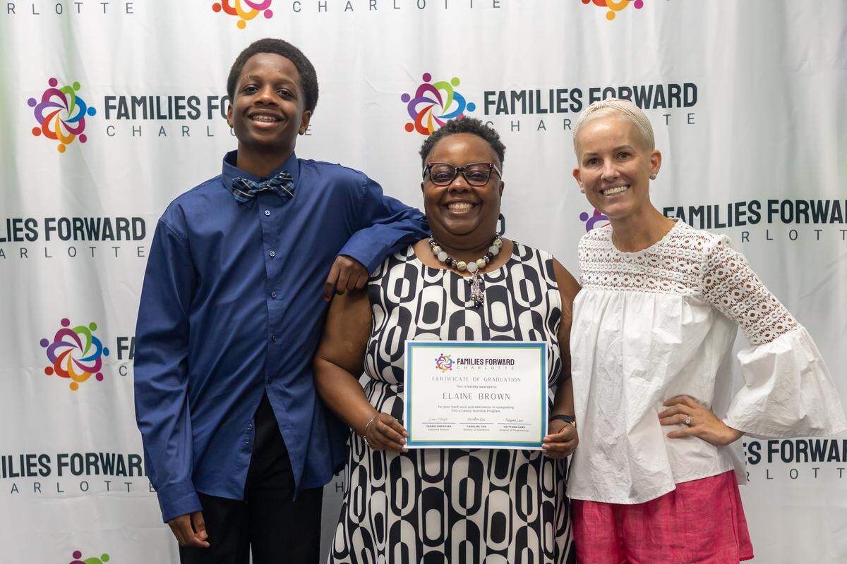 Elaine Brown (center) and her 15-year-old son overcame uncertain circumstances to find stability through Families Forward Charlotte.