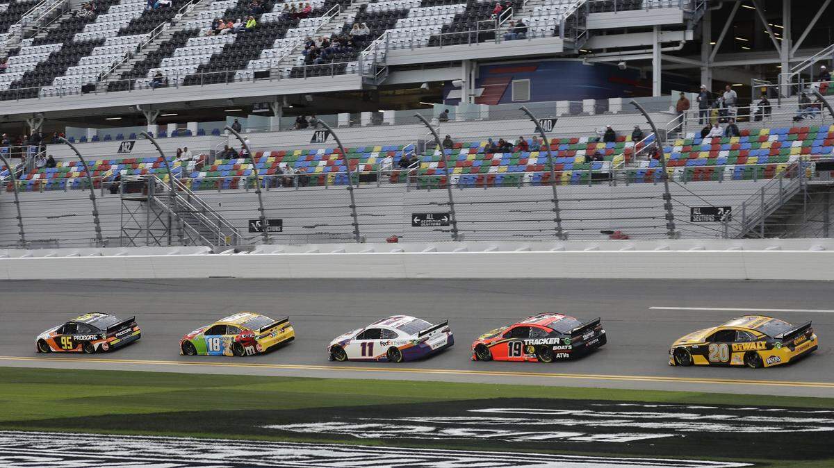 Christopher Bell (95), Kyle Busch (18), Denny Hamlin (11), Martin Truex Jr. (19) and Erik Jones (20) draft each other during a practice session for the NASCAR Daytona 500 auto race Friday, Feb. 14, 2020, at Daytona International Speedway in Daytona Beach, Fla. (AP Photo/Chris O’Meara)